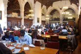 hand out flyers in the Yale University dinning hall