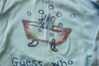 create a hand drawn painting on a baby romper