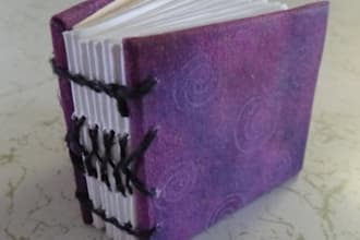 create a miniature hand sewn blank book