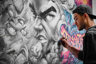 paint real graffiti art on the street wall