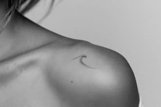 create a small minimalistic fine line spiritual tattoo