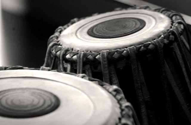 play indian classical instrument called tabla