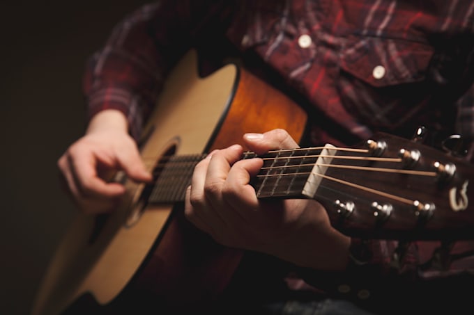 play the acoustic guitar