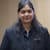 Nitya A
