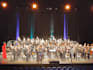 compose or arrange music for symphonic band or brass band