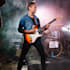 play an electric guitar solo or rhythm track in any style