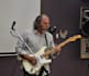 teach you to play guitar or bass