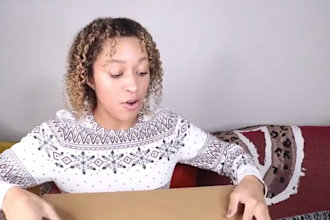 make an unboxing video of your product as a female model