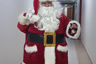 do amazing santa dance holding your logo and merry christmas greeting video