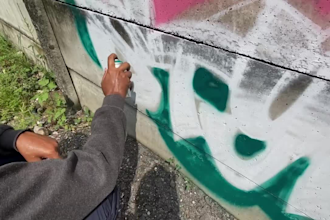 paint a wonderful real graffiti on the street hidden wall
