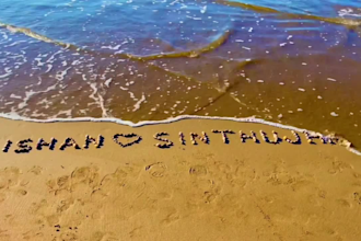 write your message using colorful stones in the beach
