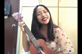 play ukulele and sing christmas song or happy birthday song