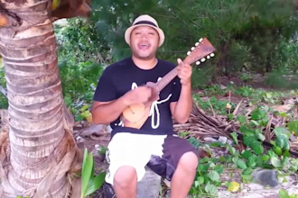 sing a personalized anniversary song with my ukulele at the beach