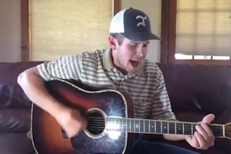 professional male country music singer songwriter and acoustic guitarist