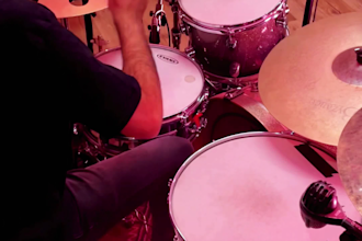 give you drum lessons in spanish