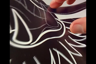 create graphic shirt or merch designs in linocut style