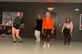 perform a belly girl group choreography in a high quality dance video on stage