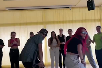 perform a professional afro and hip hop group dance