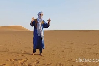 make high quality of spokenperson video from sahara desert vibe