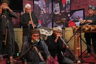 produce music with traditional bamboo instrument