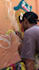 painting a real graffiti realistic on the street wall