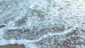 write your message creatively on a beach as  video or photo