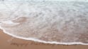 write your message creatively on a beach as  video or photo