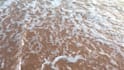 write your message creatively on a beach as  video or photo