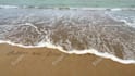 write your message using colorful stones in the beach