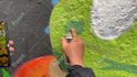 paint real graffiti art on the street wall