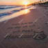 write your text on sand with natural shells and beach stones