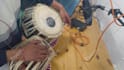 play indian classical instrument called tabla