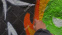 paint real graffiti art on the street wall