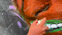 paint real graffiti art on the street wall