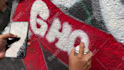 paint real graffiti art on the street wall