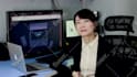 make a chinese female spokesperson video in real office background