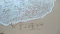 write your message creatively on a beach as  video or photo