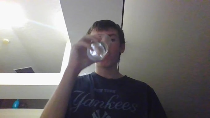drink water and look at the camera