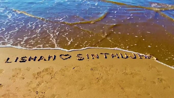 write your message using colorful stones in the beach