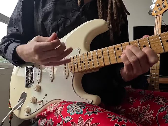 record a guitar part to match and uplift your song