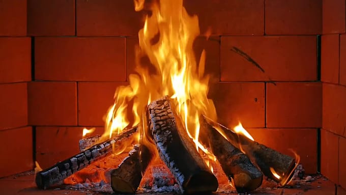 create a cozy 4k fireplace video with crackling sounds