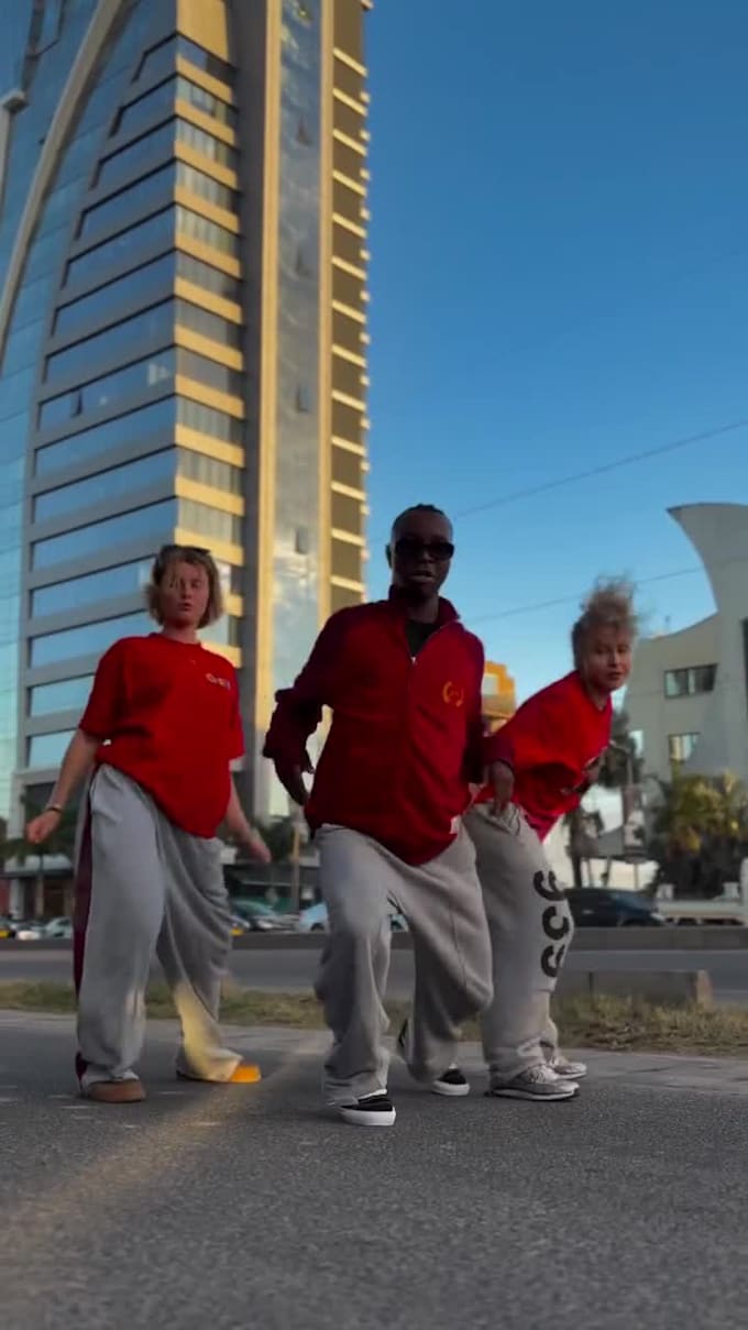 perform an energetic afro dance video and group dance challenge