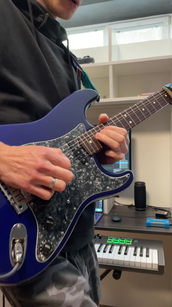 compose and record a tasteful guitar solo or rhythm
