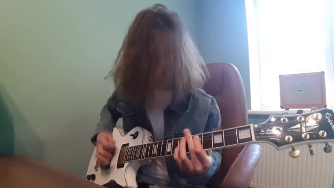 Hire a freelancer to write nasty guitar riffs and full metal songs
