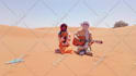 wish you a happy birthday in the sahara desert with a guitar