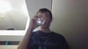 drink water and look at the camera