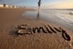 create custom sandwriting ai art on a beautiful beach